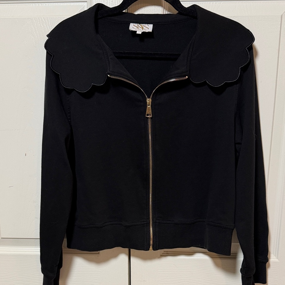 SSYS Lightweight Full Zip Black Jacket with Scalloped Collar and Gold Zipper.